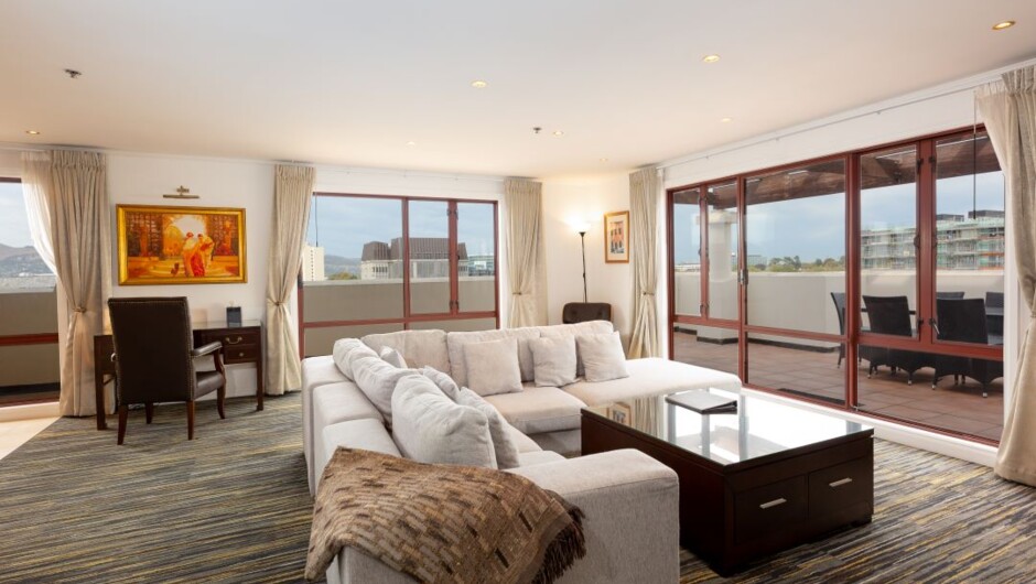 Boasting 125sqm of space, our Penthouse Suites have two large bedrooms, a large open-plan lounge, dining area, executive desk and fully equipped kitchen. With a wrap-around balcony and sliding doors that open from the living and dining areas to the outsid