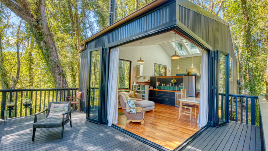 Large corner bifolds doors invites nature in. The deck is the perfect spot to soak up nature and relax with birdsong.