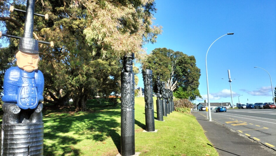 Carved pou recording the history of all who took part in the battle here