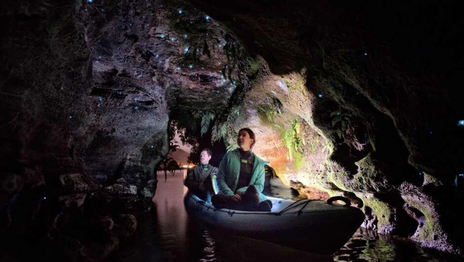 Couple viewing beautiful glow worms