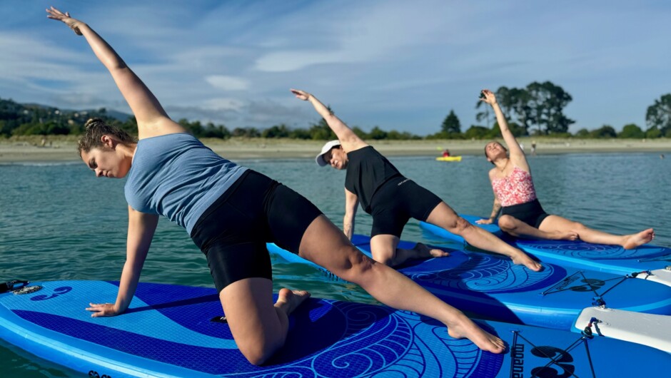 Stretch into new yoga poses on the paddleboard, all adapted for your level.