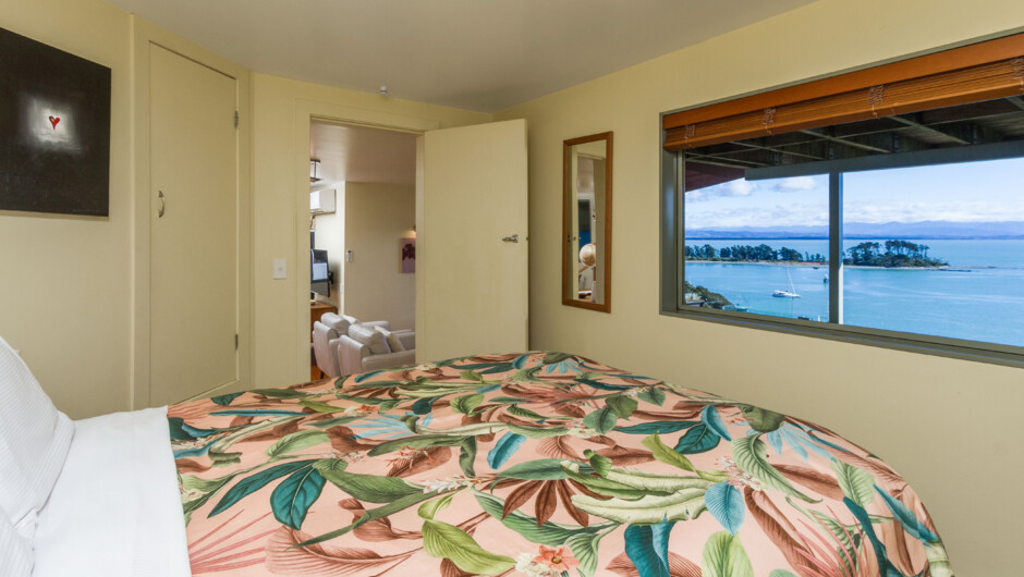 Comfortable Queen size bed with stunning views over Tasman Bay & the harbour entrance