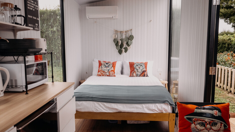 Tiny house living with a stylish interior and views that bring nature right to your doorstep.