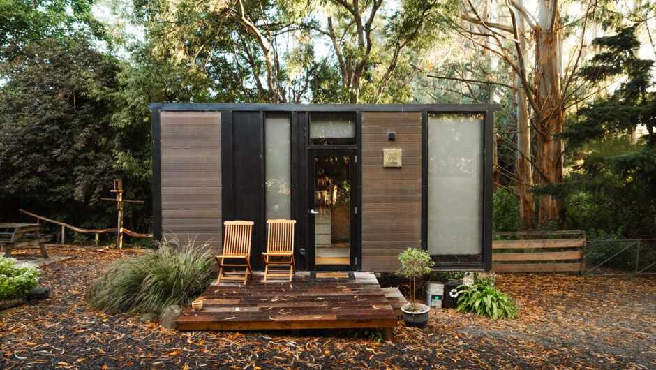 Nestled amidst lush greenery, our cosy tiny house offers a perfect retreat in nature.