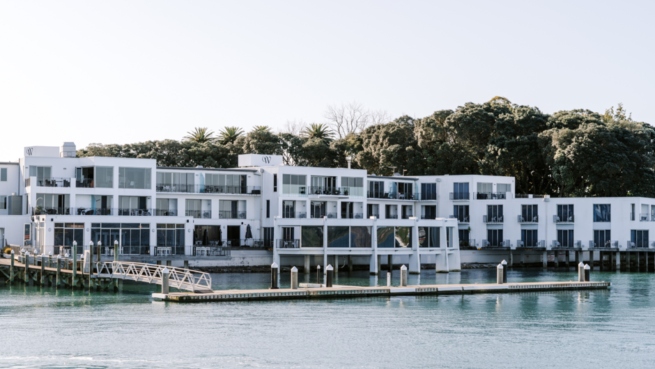 Trinity Wharf's exterior captured from a boat on the harbour.