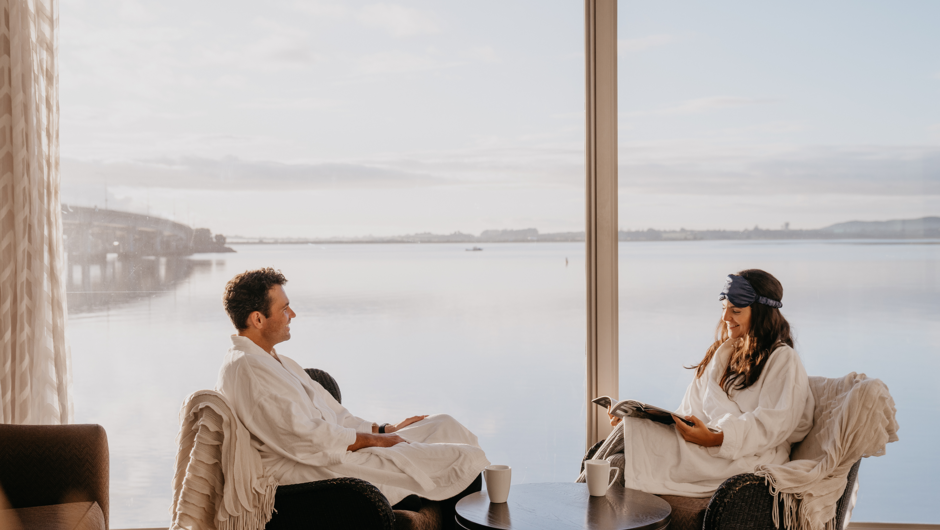 Hotel guests enjoying a relaxing morning overlooking the Tauranga Harbour.