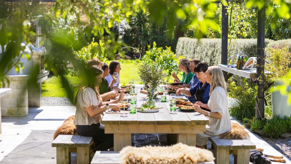 Sitting in the outdoor cooking and dining area at Hapuku Kitchen