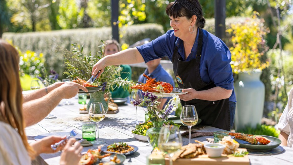 Enjoy your kai moana (seafood) in Hapuku Kitchen's outdoor dining area