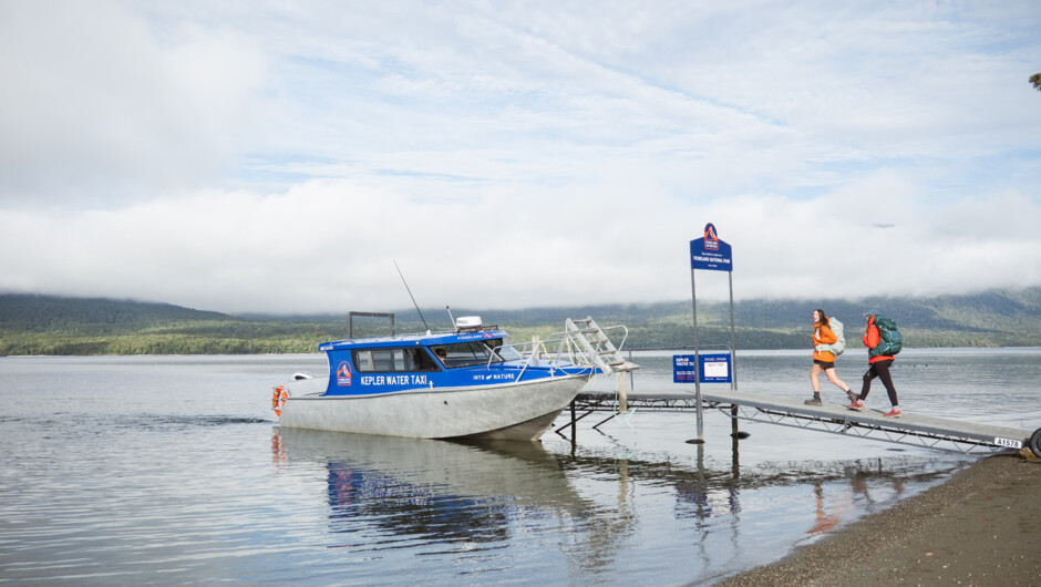 Walkers boarding the Kepler Water Taxi for a day walk on the Kepler Track.