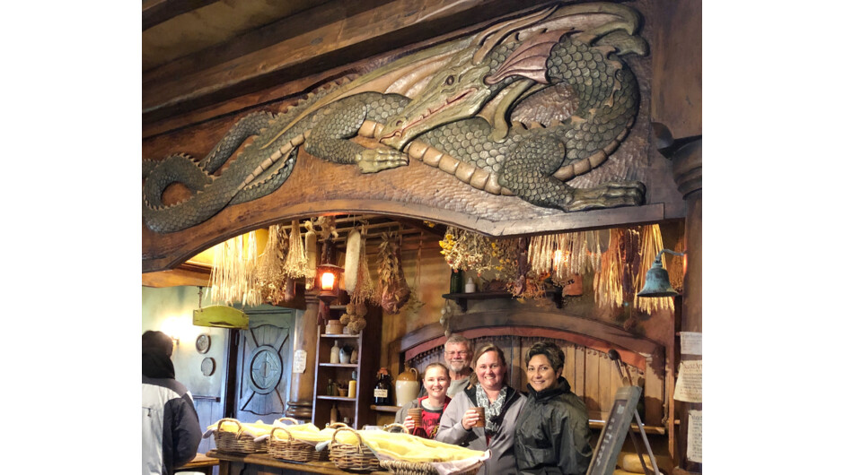 Tania tour guide with group. Green Dragon Inn, Hobbiton