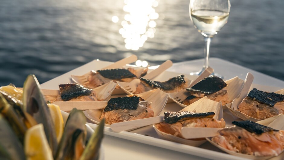 Marlborough salmon and Greenshell Mussels, enjoyed at the source in the Marlborough Sounds.