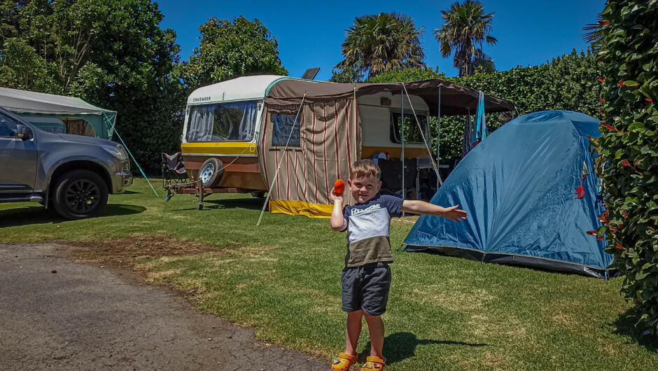 Caravan and young boy having fun