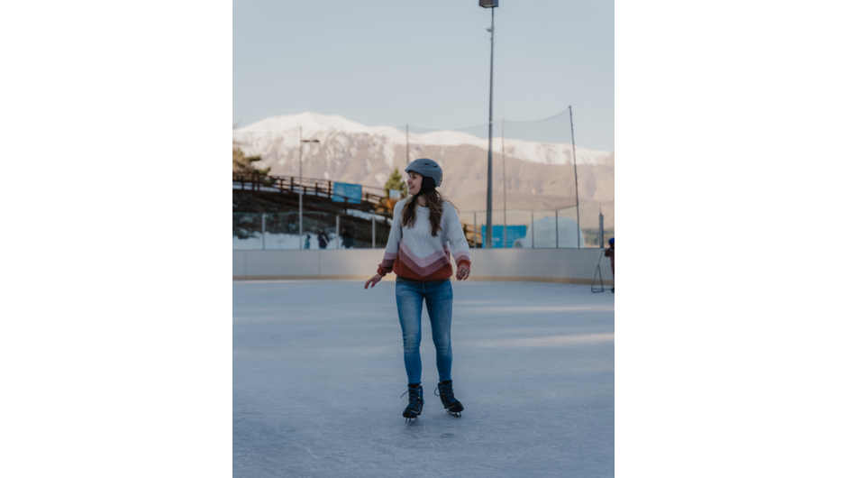 Outdoor ice rink with mountain views