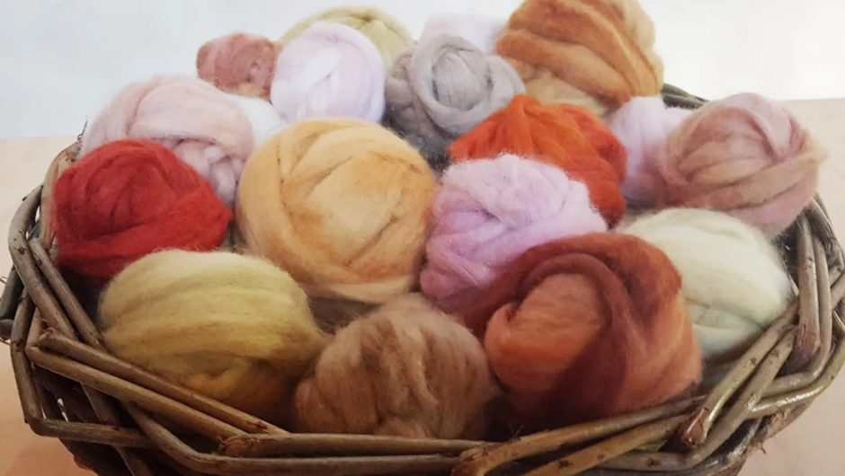 Bundles of materials dyed using plants and organic matter, used in our Eco Dyeing Workshop.