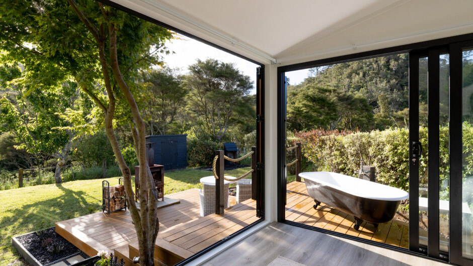 Bedroom view with outdoor bath and fire place.