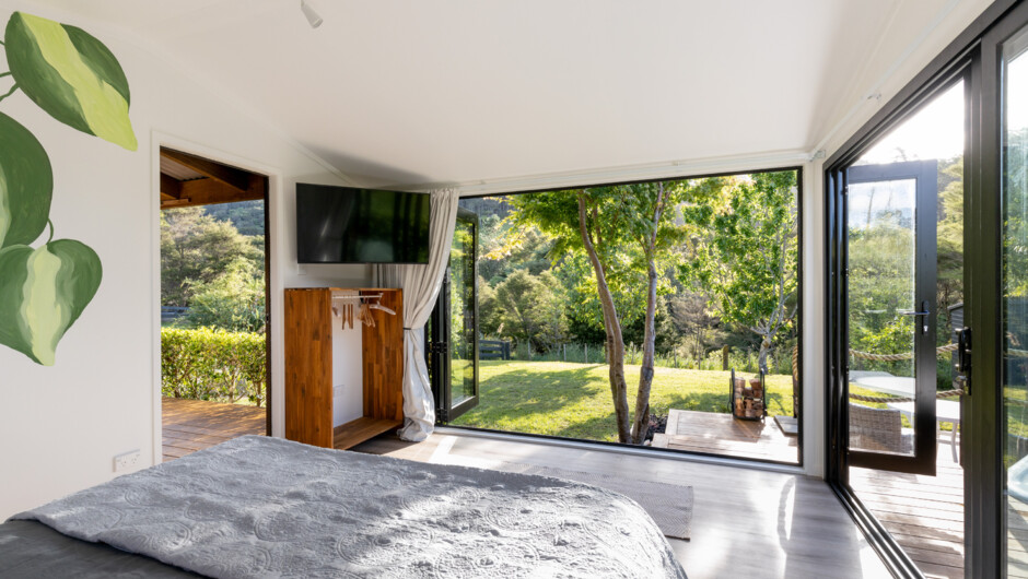 Bedroom space with beautiful open doors.