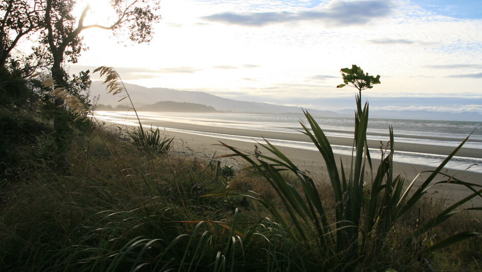 Sunset over a beautiful bay in the Abel Tasman National Park