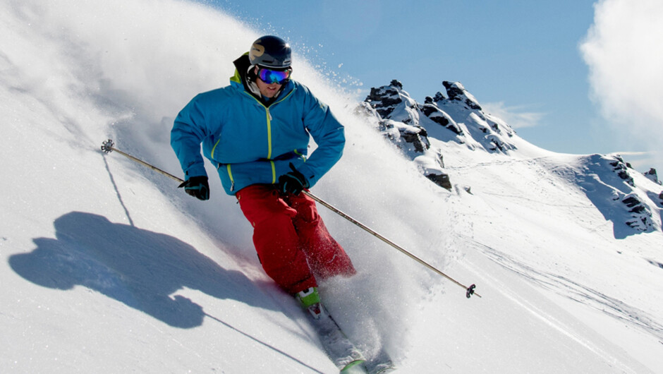 Skiing Treble Cone's Summit Slopes on a blue bird day