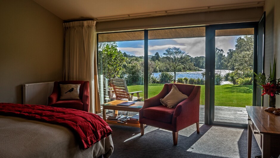 Experience stylish wilderness accommodation alongside the Moeraki River Rapids.